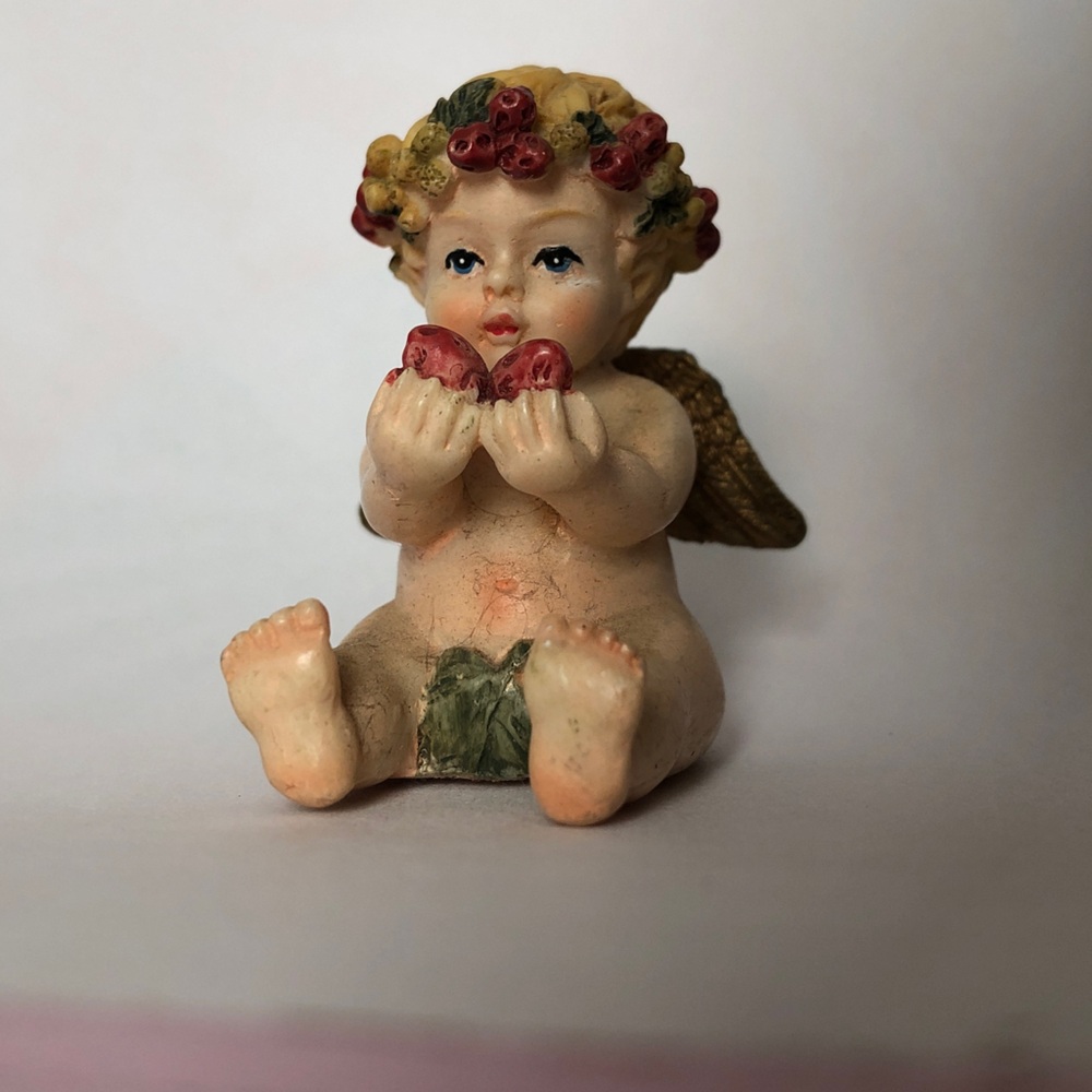 Cherubic Angel Figurine with Floral Accents
